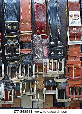 Stock Image - Belts on display Stand outside a shop Pune, Maharashtra, India. Fotosearch