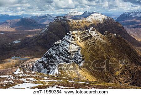 Ben Alligin capped in snow near Torridon in the Highlands of Scotland. View Large Photo Image Picture - Ben Alligin capped in snow near Torridon in the Highlands of Scotland.. Fotosearch