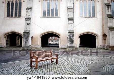 Stock Image - Bench on a square, Lincoln's Inn Chapel, London, UK.. Fotosearch