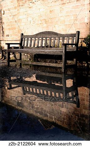 Bench reflected in pool of water. View Large Photo Image Picture - Bench reflected in pool of water.. Fotosearch