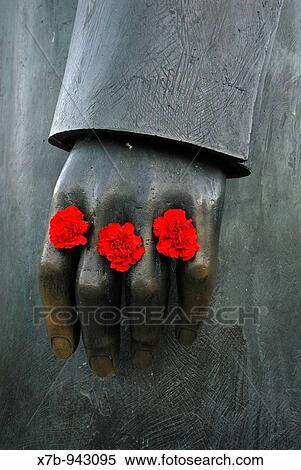 Berlin Germany Red carnations left between the fingers of the Friedrich Engels statue on Marx-Engels-Forum View Large Photo Image Stock Photography - Berlin Germany Red carnations left between the fingers of the Friedrich Engels statue on Marx-Engels-Forum. Fotosearch