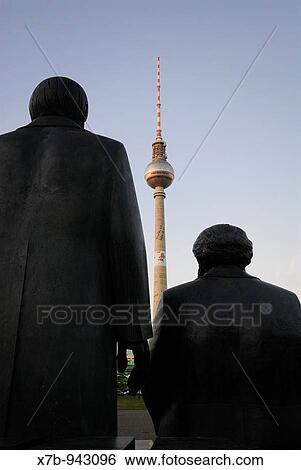 Berlin Germany Staue of Karl Marx right & Friedrich Engels on Marx-Engels-Forum, facing the Furnsehturm TV tower on Alexanderplatz View Large Photo Image Stock Photograph - Berlin Germany Staue of Karl Marx right & Friedrich Engels on Marx-Engels-Forum, facing the Furnsehturm TV tower on Alexanderplatz. Fotosearch
