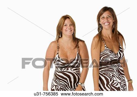 Best friends in their early 40s wearing exactly the same dress View Large Photo Image Stock Photography - Best friends in their early 40s wearing exactly the same dress. Fotosearch