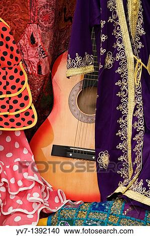 Between Moorish flamenco guitar and flamenco dresses C? rdoba's shop View Large Photo Image Stock Image - Between Moorish flamenco guitar and flamenco dresses C? rdoba's shop. Fotosearch