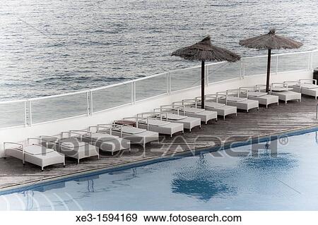 Between the pool and the sea View Large Photo Image Stock Photo - Between the pool and the sea. Fotosearch