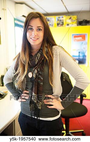 Beverwijk, Netherlands. Young brunette, working at a repair and service-centre for professional photographers. View Large Photo Image Stock Image - Beverwijk, Netherlands. Young brunette, working at a repair and service-centre for professional photographers.. Fotosearch