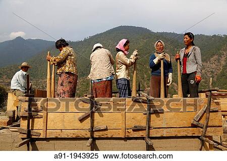 Bhutan (kingdom of), City of Punakha, building site of a traditional house made of adobe walls View Large Photo Image Stock Photography - Bhutan (kingdom of), City of Punakha, building site of a traditional house made of adobe walls. Fotosearch