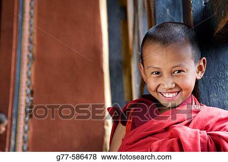 Stock Photo - Bhutan. Paro. Paro Dzong Monastery. Little Buddhist monk.. Fotosearch
