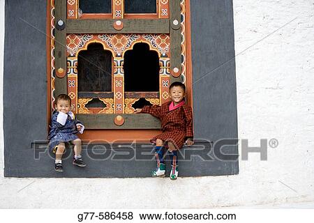 Bhutan. Thimpu. Thimpu Dzong Monastery. Buddhist Festival (Tsechu). Bhutanese little boys. View Large Photo Image Stock Photo - Bhutan. Thimpu. Thimpu Dzong Monastery. Buddhist Festival (Tsechu). Bhutanese little boys.. Fotosearch