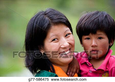 Bhutan. Trongsa. Woman with child. View Large Photo Image Stock Photography - Bhutan. Trongsa. Woman with child.. Fotosearch