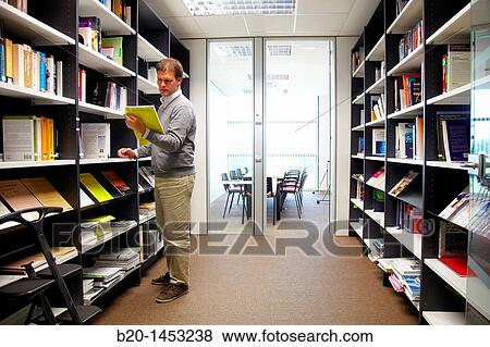 Bibliography, consulting scientific article, looking for information on digital TV and multimedia services, library, Vicomtech-IK4 Visual Interaction and Communication Technologies Centre View Large Photo Image Stock Photo - Bibliography, consulting scientific article, looking for information on digital TV and multimedia services, library, Vicomtech-IK4 Visual Interaction and Communication Technologies Centre. Fotosearch