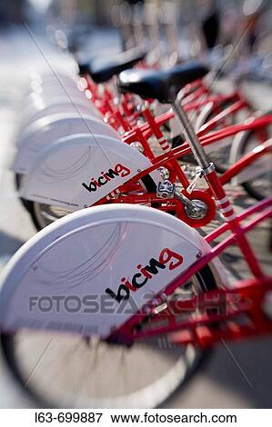 ? Bicing? (Municipal self-service rental bikes). Barcelona. Catalonia. Spain. Selective focus image. View Large Photo Image Stock Photo - ? Bicing? (Municipal self-service rental bikes). Barcelona. Catalonia. Spain. Selective focus image.. Fotosearch