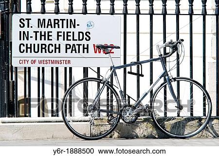 Bicycle parked by street sign near Trafalgar Square in the heart of London, UK on a very sunny Summer day View Large Photo Image Stock Image - Bicycle parked by street sign near Trafalgar Square in the heart of London, UK on a very sunny Summer day. Fotosearch