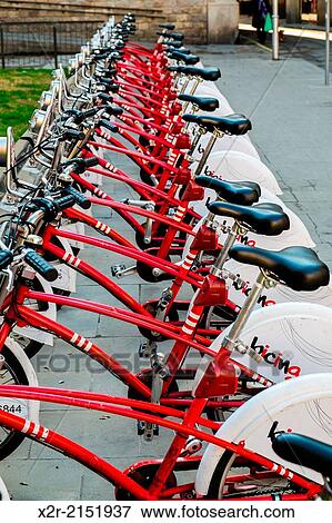 Bicycles for hire by the hour on the streets of Barcelona, Spain. View Large Photo Image Stock Photo - Bicycles for hire by the hour on the streets of Barcelona, Spain.. Fotosearch