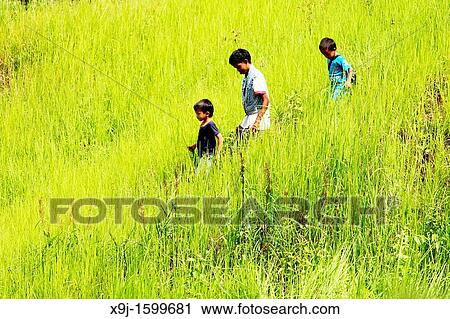 Stock Image - Bidayu Kid in Kidding Village Borneo Highland, Kuching, Sarawak, Borneo, Malaysia. Fotosearch
