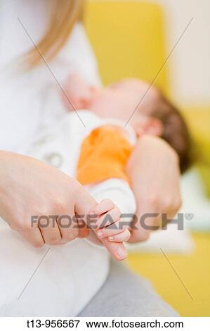Big and small finger, mother and her infant baby View Large Photo Image Stock Photo - Big and small finger, mother and her infant baby. Fotosearch