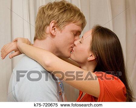 Stock Photography - big hug and kiss. Fotosearch