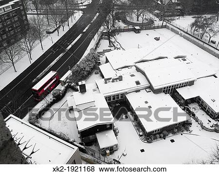 Big red Bus stopped in snowed city View Large Photo Image Stock Photo - Big red Bus stopped in snowed city. Fotosearch