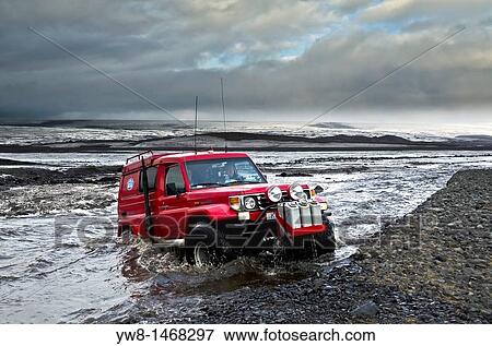 Big Red crossing the Tungnaa glacial river filled with ash from the Grimsvotn volcanic eruption, Iceland Eruption began on May 21, 2011 spewing tons of ash View Large Photo Image Stock Photo - Big Red crossing the Tungnaa glacial river filled with ash from the Grimsvotn volcanic eruption, Iceland Eruption began on May 21, 2011 spewing tons of ash. Fotosearch