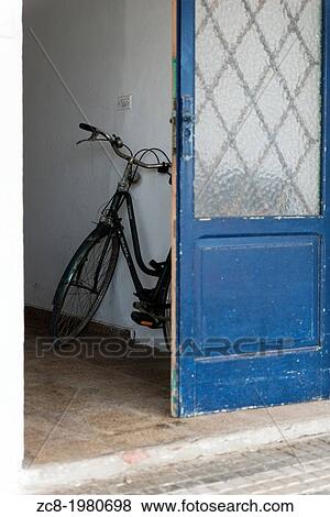 Bike in the entrance of a house in Formentera, Balearic Islands, Spain. May 2013. View Large Photo Image Stock Photo - Bike in the entrance of a house in Formentera, Balearic Islands, Spain. May 2013.. Fotosearch