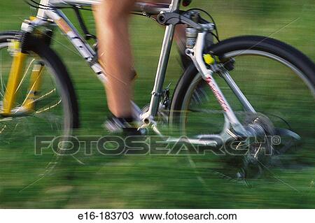 Bike moving through fields View Large Photo Image Stock Image - Bike moving through fields. Fotosearch