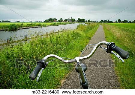 Bike route near Bolsward, Friesland province (Fryslan), Netherlands View Large Photo Image Stock Image - Bike route near Bolsward, Friesland province (Fryslan), Netherlands. Fotosearch