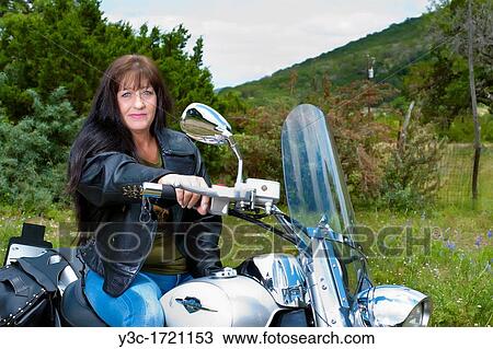 Biker Lady - Portrait of a mature Native American Woman in leather jacket with her motorcycle View Large Photo Image Stock Image - Biker Lady - Portrait of a mature Native American Woman in leather jacket with her motorcycle. Fotosearch