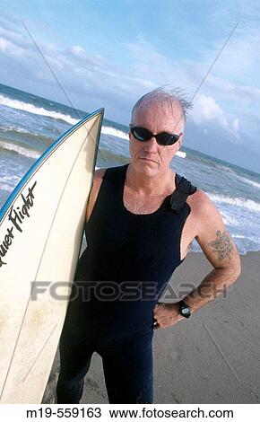 biker looking surfer View Large Photo Image Stock Image - biker looking surfer. Fotosearch