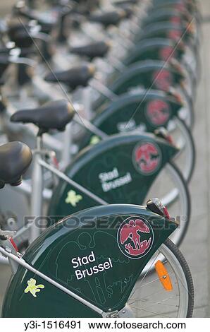 Bikes in Brussels, Belgium available for rent, provided by the Brussels-Capital Region and City of Brussels Stad Brussel, whose logos are shown View Large Photo Image Stock Image - Bikes in Brussels, Belgium available for rent, provided by the Brussels-Capital Region and City of Brussels Stad Brussel, whose logos are shown. Fotosearch