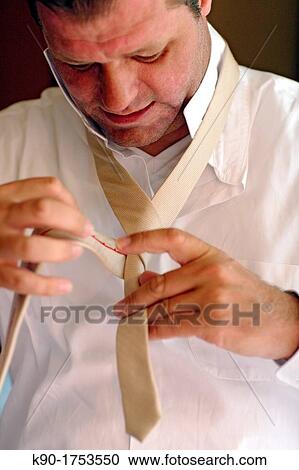 Binding the tie, Groom, Dressing up, Mallorca, Spain, Europe View Large Photo Image Stock Image - Binding the tie, Groom, Dressing up, Mallorca, Spain, Europe. Fotosearch