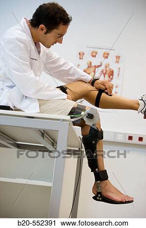 Stock Image - Biomechanics: researchers developing exoskeleton intended for people suffering from muscular weakness in the lower limbs. Fatronik Foundation, Research Technology Center. Donostia, San Sebastian, Gipuzkoa, Euskadi. Spain.. Fotosearch