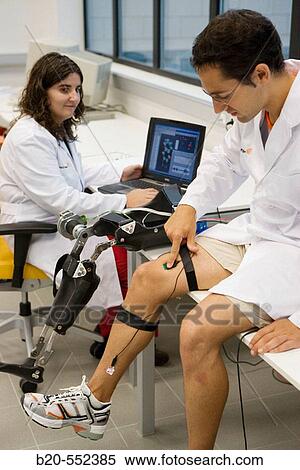 Stock Photography - Biomechanics: researchers developing exoskeleton intended for people suffering from muscular weakness in the lower limbs. Fatronik Foundation, Research Technology Center. Donostia, San Sebastian, Gipuzkoa, Euskadi. Spain.. Fotosearch