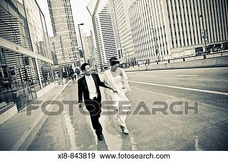 birde and groom walking downtown chicago View Large Photo Image Stock Photo - birde and groom walking downtown chicago. Fotosearch