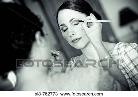 Birde putting on makeup View Large Photo Image Stock Image - Birde putting on makeup. Fotosearch