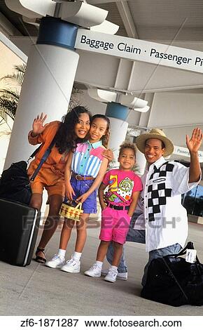 Black african american family at airport on holiday getting ready to travel together and have fun waving View Large Photo Image Stock Photo - Black african american family at airport on holiday getting ready to travel together and have fun waving. Fotosearch