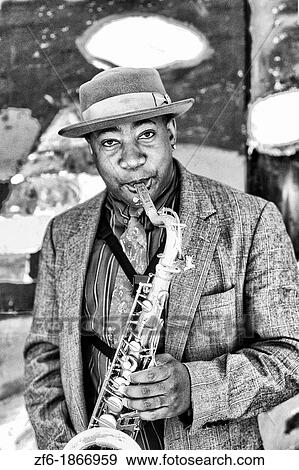 Black Afro American man playing jazz with saxophone or sax near Fisherman Wharf in San Francisco California View Large Photo Image Stock Photo - Black Afro American man playing jazz with saxophone or sax near Fisherman Wharf in San Francisco California. Fotosearch