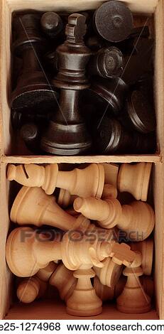 Black and white chess pieces in a compartmentalised box. View Large Photo Image Stock Photo - Black and white chess pieces in a compartmentalised box.. Fotosearch