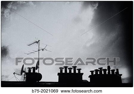 black and white photography of fireplaces and a television antenna in Paris, France View Large Photo Image Stock Photo - black and white photography of fireplaces and a television antenna in Paris, France. Fotosearch