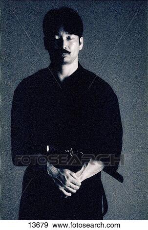 Black and white portrait of asian man in traditional martial arts costume View Large Photo Image Stock Photo - Black and white portrait of asian man in traditional martial arts costume. Fotosearch