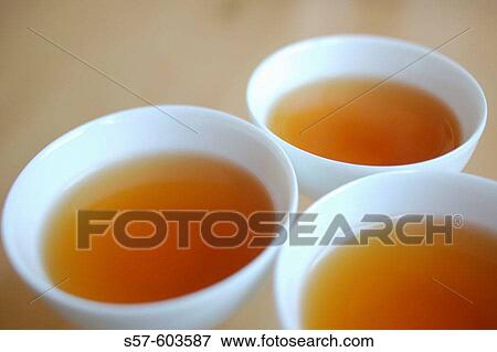 Black Asian tea in white bowls View Large Photo Image Stock Photo - Black Asian tea in white bowls. Fotosearch