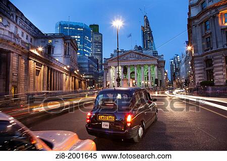 Stock Photography - Black cap on Bank Junction, The Roayl Exchange, The Bank of England, The City of London, England.. Fotosearch