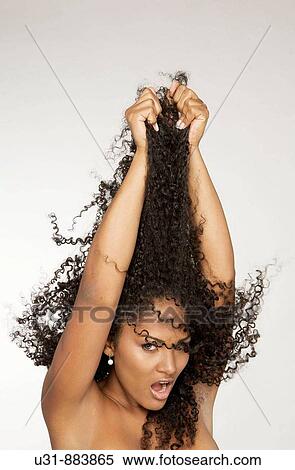 Black Latin girl pulls her sexy wavy hair View Large Photo Image Stock Photography - Black Latin girl pulls her sexy wavy hair. Fotosearch