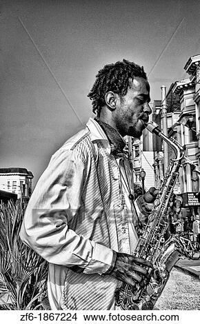 Black man playing sax in Gay Pride Weekend Pink Celebration in the gay Castro District of San Francisco California View Large Photo Image Picture - Black man playing sax in Gay Pride Weekend Pink Celebration in the gay Castro District of San Francisco California. Fotosearch