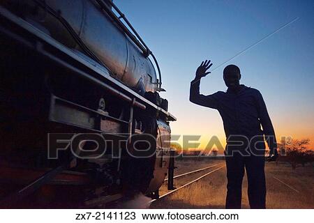 Black men say goodbye to Livingstone Express luxury train. The ROYAL LIVINGSTONE EXPRESS is a steam train built in the 1920s with PULLMAN-style carriages. View Large Photo Image Stock Image - Black men say goodbye to Livingstone Express luxury train. The ROYAL LIVINGSTONE EXPRESS is a steam train built in the 1920s with PULLMAN-style carriages.. Fotosearch