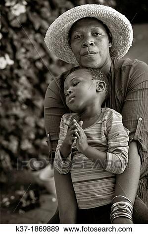 Stock Photo - Black mother with child. Fotosearch