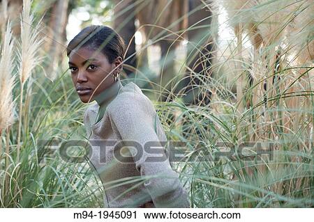 Stock Image - Black woman posing as a model.. Fotosearch