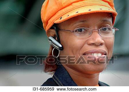 Black woman with cell phone and hat View Large Photo Image Stock Photo - Black woman with cell phone and hat. Fotosearch