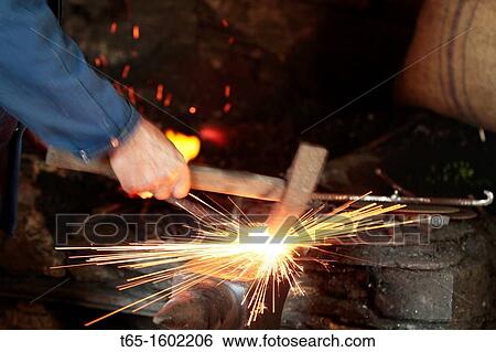 Blacksmith forge pounding and shaping a turning plow View Large Photo Image Stock Photograph - Blacksmith forge pounding and shaping a turning plow. Fotosearch