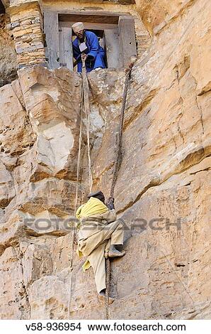 Picture - Blind monk pulled up by a leather rope. Monastery of Debre Damo. Tigray. Ethiopia.. Fotosearch