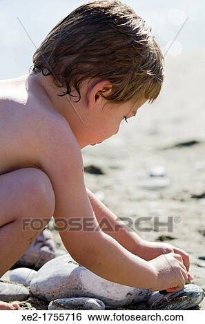 Blond boy playing at the beach, Crete, Greece View Large Photo Image Stock Photograph - Blond boy playing at the beach, Crete, Greece. Fotosearch